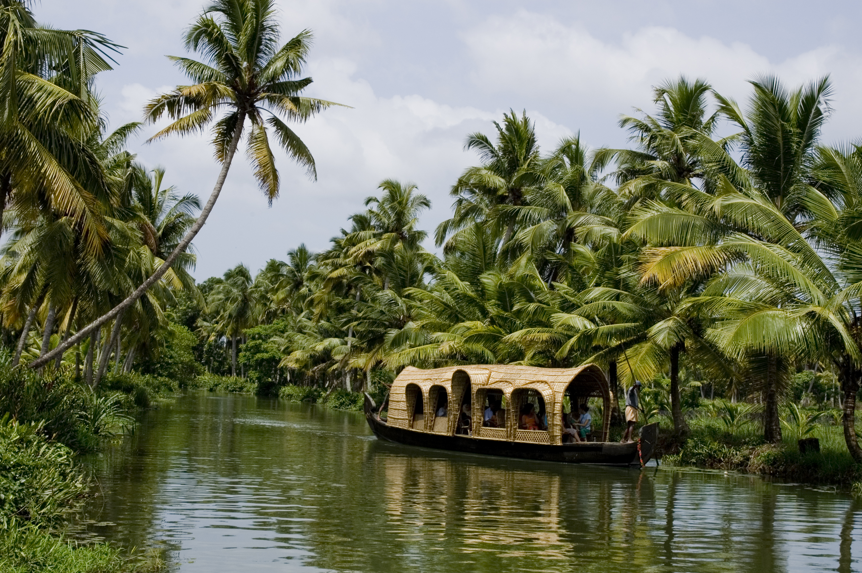 Traditional houseboats on Kottayam backwaters Kerala at golden hour Alleppey